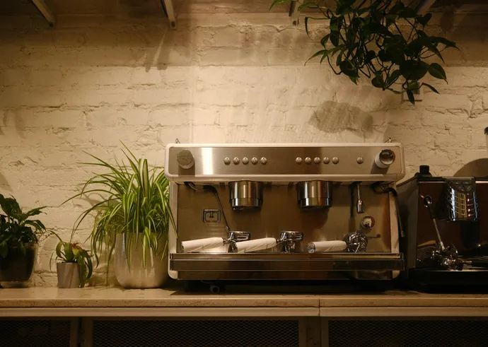 Commercial two-group espresso machine on a cafe counter
